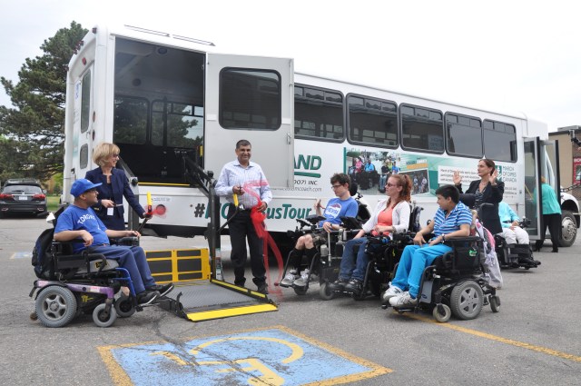 Jess, LIFE Toronto Program particiapants, Keith Rashid and March of Dimes Canada President and CEO Andria Spindel take part in the ribbon-cutting ceremony for the #MODCBusTour. 