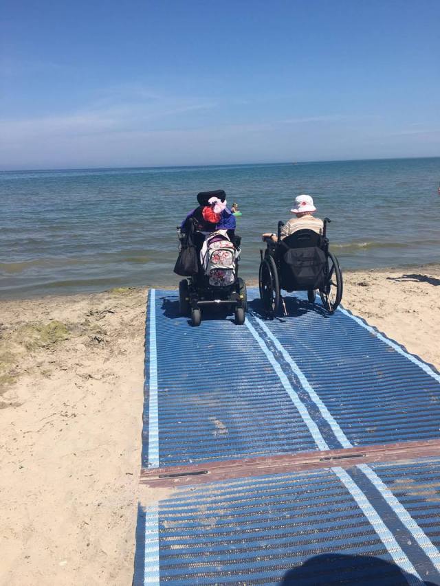 P.E.T. Consumers Liane Roberts and Sarah Hamlin on the Mobi Mat enjoying the water at Lakeside Park